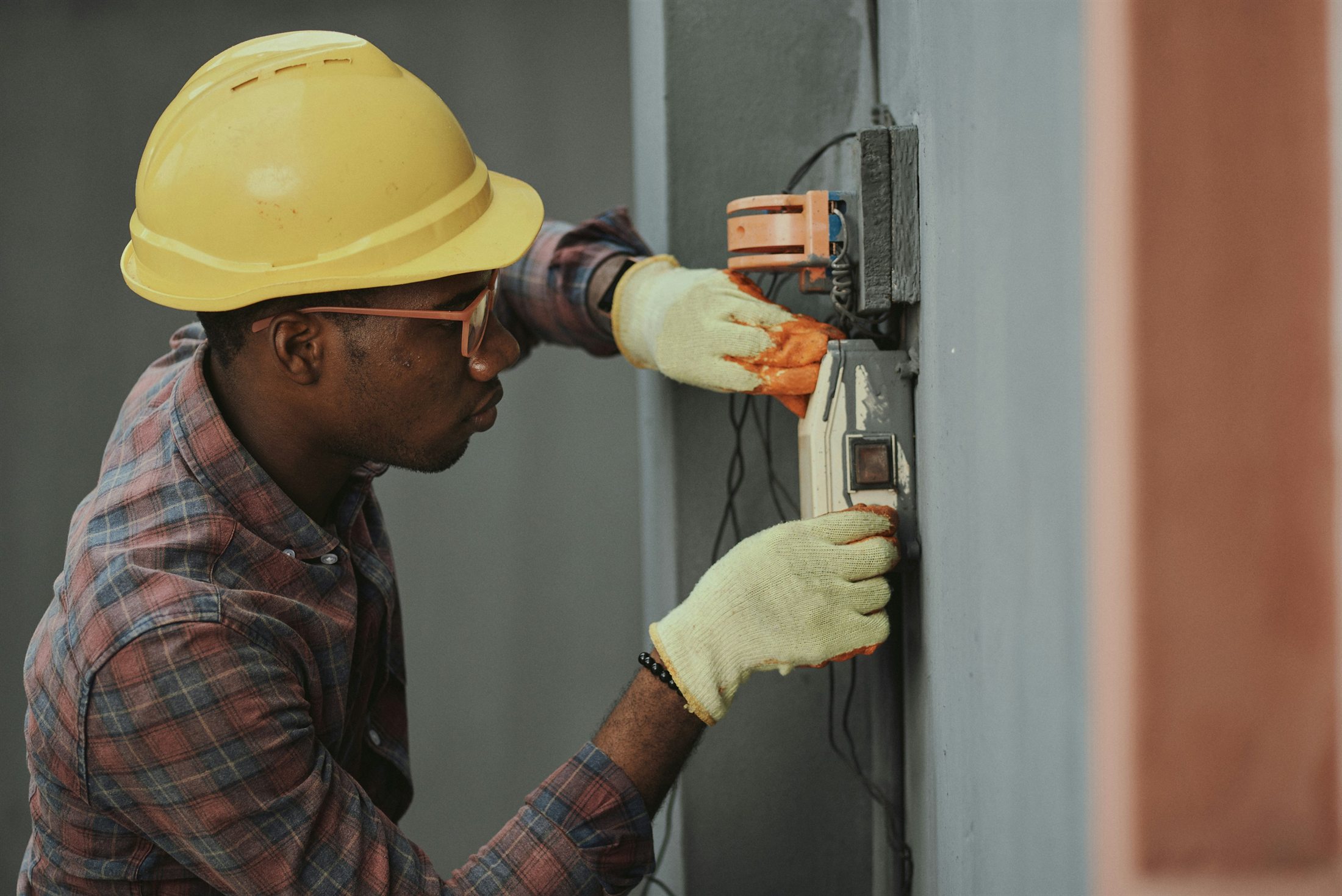 Electrician handling wiring during closeout