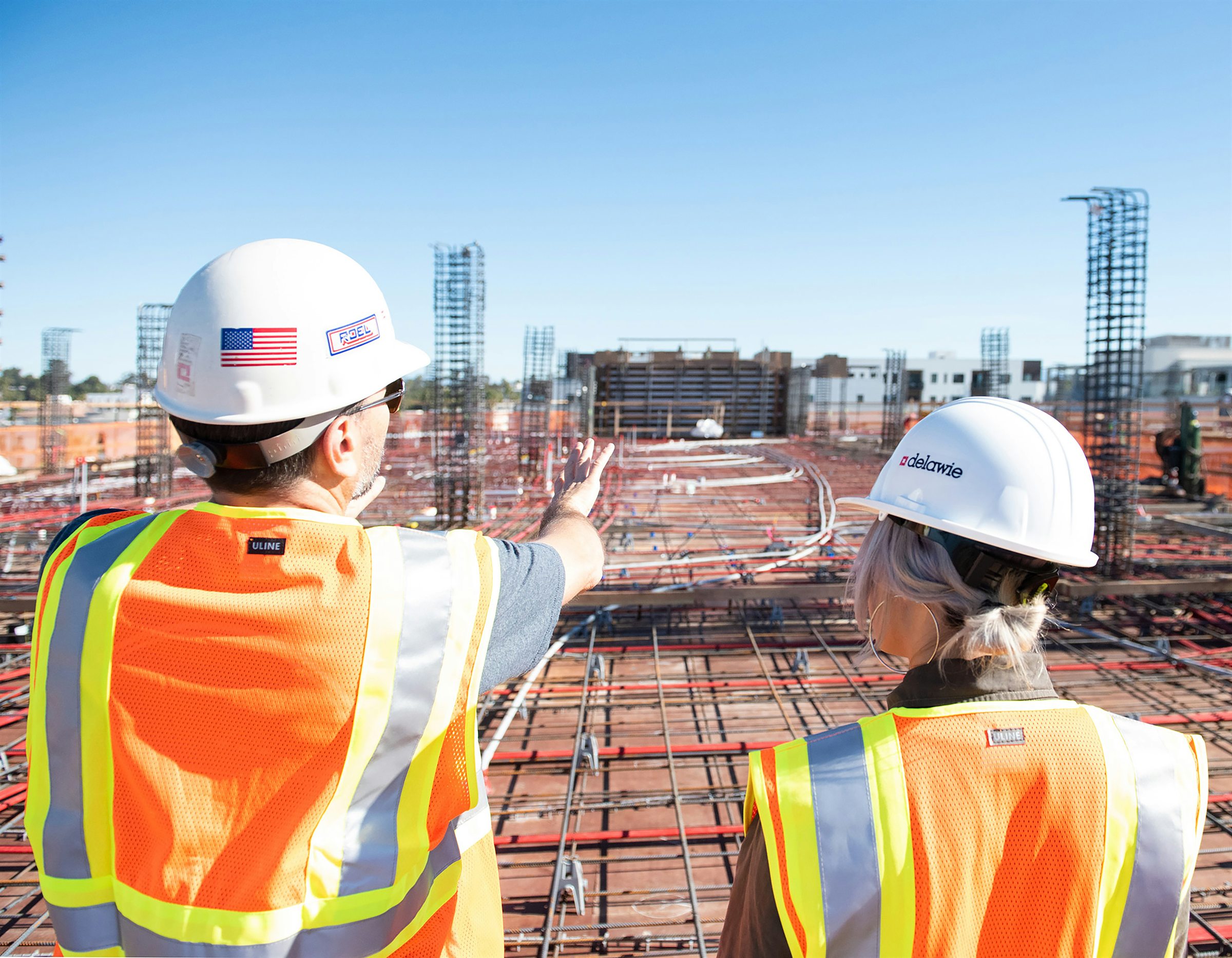 Construction supervisors reviewing a commercial job site